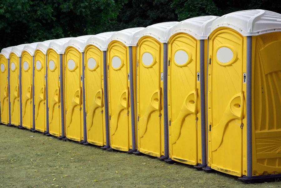 yellow portable toilets outside